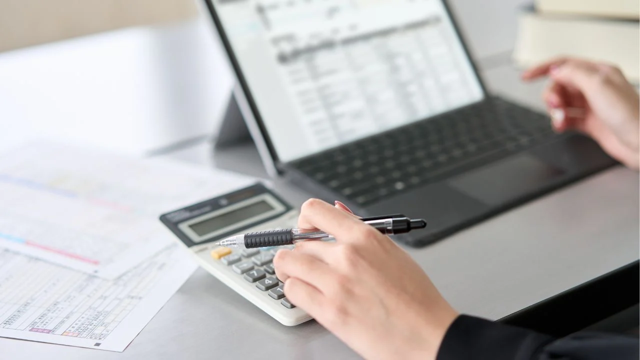 Woman cleaning up bookkeeping records